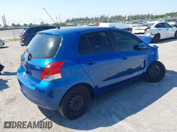 2009 Toyota Yaris with VIN JTDKT903X95257701, listed as a IAAI auction lot 41796420 with 86,953 mi miles. Bid and sale history available at carsss.com. Image 4.