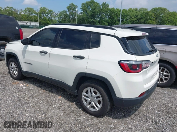 2018 Jeep Compass Sport with VIN 3C4NJCAB0JT124679, listed as a IAAI auction lot 42720262 with 119,267 mi miles and . Bid and sale history available at DreamBid. Image 3.