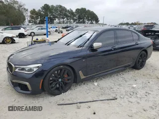 2019 BMW 7 Series M760i xDrive with VIN WBA7H6C51KG615276, listed as a Copart auction lot 79597234 with 39,195 mi miles and Salvage Title. Bid and sale history available at carsss.com. Image 1.