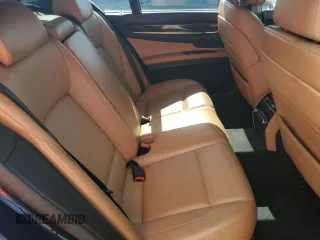 2012 BMW 7 Series with VIN WBAKX6C58CC197207, listed as a Copart auction lot 84153784 with 130,049 mi miles and Salvage title. Bid and sale history available at DreamBid. Image 10.