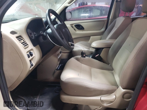 2004 Ford Escape XLS with VIN 1FMYU021X4DA05312, listed as a Copart auction lot 86185954 with 186,010 mi miles and Salvage Title. Bid and sale history available at DreamBid. Image 7.