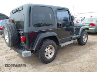 2001 Jeep Wrangler Sahara with VIN 1J4FA59S81P321733, listed as a IAAI auction lot 42164863 with 174,509 mi miles. Bid and sale history available at carsss.com. Image 4.