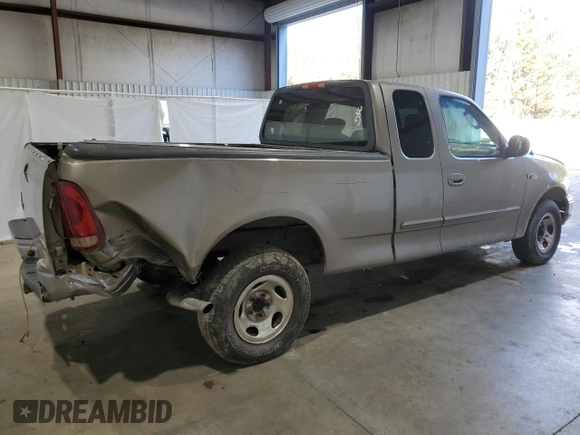 2003 Ford F-150 XL with VIN 1FTRX17283NA46215, listed as a Copart auction lot 85194094 with 168,415 mi miles and Salvage title. Bid and sale history available at DreamBid. Image 3.