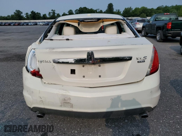 2012 Lincoln MKS z VIN 1LNHL9ER0CG803078, wystawiony jako Copart lot #60514765 z przebiegiem 82 715 mil mil oraz Szkoda całkowita • Salvage title. Historia ofert i sprzedaży dostępna na DreamBid. Obrazek 6.