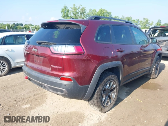 2019 Jeep Cherokee Trailhawk with VIN 1C4PJMBX5KD421043, listed as a IAAI auction lot 42570336 with 114,463 mi miles and . Bid and sale history available at DreamBid. Image 4.