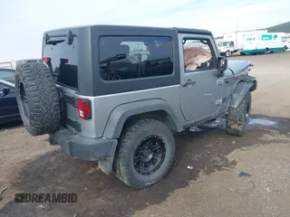 2013 Jeep Wrangler Rubicon 10th Anniversary with VIN 1C4BJWCG8DL639121, listed as a IAAI auction lot 40561773 with 56,023 mi miles and . Bid and sale history available at DreamBid. Image 4.