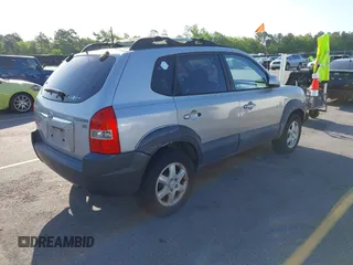 2005 Hyundai Tucson GLS with VIN KM8JN12D65U244033, listed as a IAAI auction lot 41998302 with 219,205 mi miles. Bid and sale history available at carsss.com. Image 4.