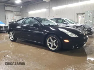 2000 Toyota Celica GTS with VIN JTDDY32T0Y0023275, listed as a Copart auction lot 50836735 with 154,144 mi miles and Salvage Title. Bid and sale history available at DreamBid. Image 4.