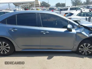 2020 Toyota Corolla Hybrid LE with VIN JTDEBRBE9LJ011672, listed as a IAAI auction lot 41832275 with 118,835 mi miles. Bid and sale history available at carsss.com. Image 12.
