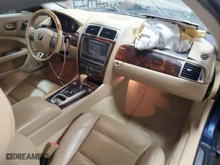 2007 Jaguar XK with VIN SAJDA44BX75B00447, listed as a Copart auction lot 50147695 with 119,467 mi miles and Salvage Title. Bid and sale history available at carsss.com. Image 8.