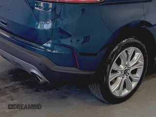 2020 Ford Edge Titanium z VIN 2FMPK3K91LBB37761, wystawiony jako IAAI lot #42829390 z przebiegiem 90 117 mil mil oraz . Historia ofert i sprzedaży dostępna na DreamBid. Obrazek 8.