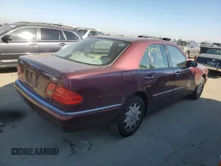 1998 Mercedes-Benz E 320 with VIN WDBJF25FXWA549962, listed as a Copart auction lot 87876005 with 303,884 mi miles and Salvage Title. Bid and sale history available at DreamBid. Image 3.