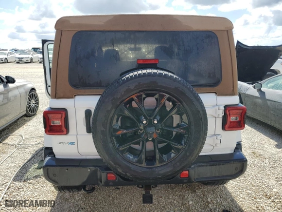 2021 Jeep Wrangler 4xe Unlimited Sahara with VIN 1C4JJXP62MW677073, listed as a Copart auction lot 77494174 with 0 mi miles and Salvage Title. Bid and sale history available at carsss.com. Image 6.