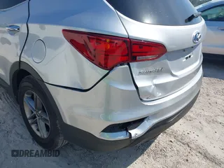 2018 Hyundai Santa Fe 2.4L z VIN 5XYZTDLB9JG513584, wystawiony jako IAAI lot #42031291 z przebiegiem 131 109 mil mil oraz . Historia ofert i sprzedaży dostępna na DreamBid. Obrazek 6.