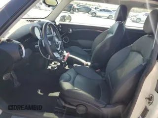 2009 MINI Hardtop S with VIN WMWMF73559TW83208, listed as a Copart auction lot 57347015 with 76,898 mi miles and Salvage title. Bid and sale history available at DreamBid. Image 7.