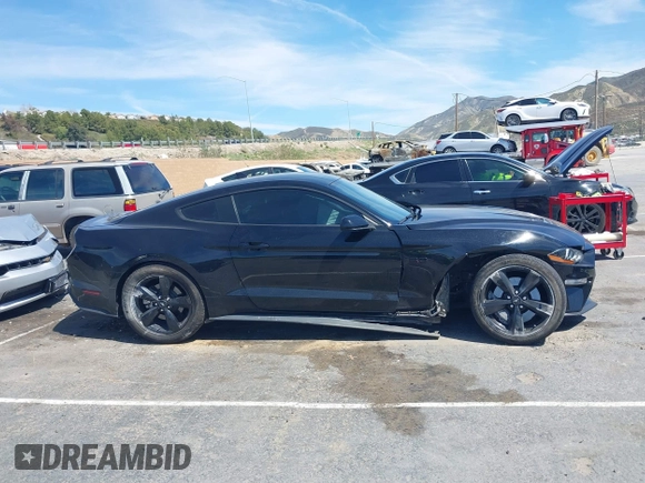 2021 Ford Mustang GT z VIN 1FA6P8CF4M5149580, wystawiony jako IAAI lot #41878355 z przebiegiem 60 028 mil mil oraz . Historia ofert i sprzedaży dostępna na DreamBid. Obrazek 13.