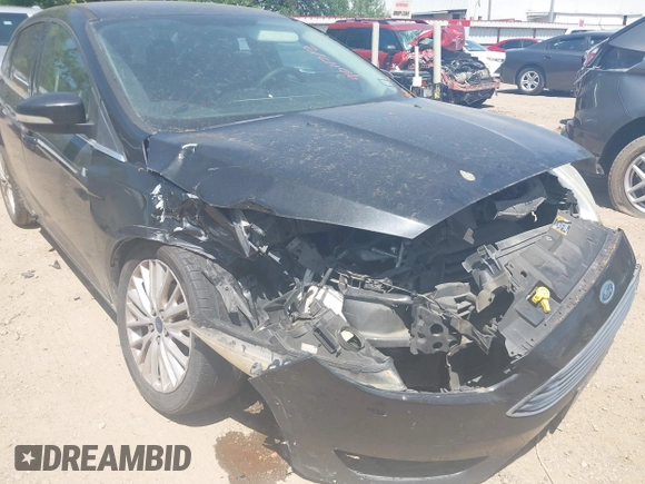 2015 Ford Focus Titanium with VIN 1FADP3J24FL385526, listed as a IAAI auction lot 42011712 with 162,696 mi miles and . Bid and sale history available at carsss.com. Image 12.