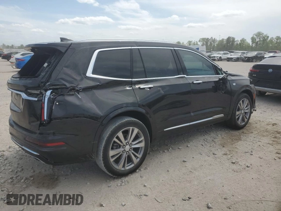 2023 Cadillac XT6 FWD Premium Luxury with VIN 1GYKPCRS6PZ127331, listed as a Copart auction lot 52951105 with 47,796 mi miles and Salvage Title. Bid and sale history available at carsss.com. Image 3.