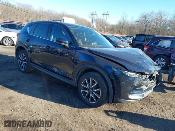 2017 Mazda CX-5 Grand Touring with VIN JM3KFBDL0H0104806, listed as a IAAI auction lot 41621964 with 60,728 mi miles. Bid and sale history available at carsss.com. Image 1.