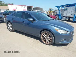 2014 Mazda 6 i Touring with VIN JM1GJ1T66E1154117, listed as a IAAI auction lot 42236667 with 105,626 mi miles and . Bid and sale history available at DreamBid. Image 1.