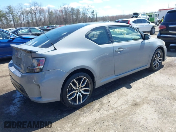 2014 Scion tC with VIN JTKJF5C70E3083839, listed as a IAAI auction lot 41886711 with 118,029 mi miles. Bid and sale history available at carsss.com. Image 4.