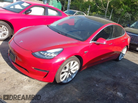 2018 Tesla Model 3 Long Range Battery with VIN 5YJ3E1EA5JF063555, listed as a IAAI auction lot 42028785 with 45,346 mi miles and . Bid and sale history available at DreamBid. Image 2.