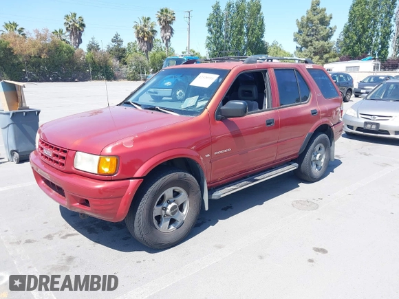 1999 Isuzu Rodeo S z VIN 4S2CK58WXX4346156, wystawiony jako IAAI lot #42328951 z przebiegiem 196 182 mil mil oraz . Historia ofert i sprzedaży dostępna na DreamBid. Obrazek 2.
