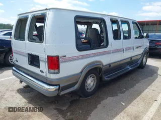 1999 Ford Econoline Cargo Recreational with VIN 1FDRE14L2XHA41059, listed as a IAAI auction lot 42067879 with 149,185 mi miles. Bid and sale history available at carsss.com. Image 4.