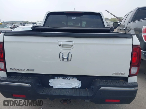 2018 Honda Ridgeline RTL-E with VIN 5FPYK3F77JB004379, listed as a IAAI auction lot 41802025 with 132,085 mi miles and . Bid and sale history available at DreamBid. Image 16.