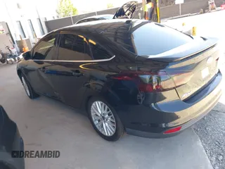 2013 Ford Focus Titanium with VIN 1FADP3J20DL143491, listed as a IAAI auction lot 42034388 with 194,388 mi miles and . Bid and sale history available at carsss.com. Image 3.