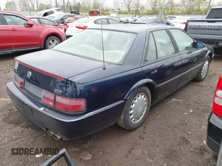 1993 Cadillac Seville Touring STS z VIN 1G6KY5297PU804313, wystawiony jako IAAI lot #42001104 z przebiegiem 242 756 mil mil oraz . Historia ofert i sprzedaży dostępna na DreamBid. Obrazek 4.