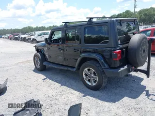 2021 Jeep Wrangler Unlimited Sahara with VIN 1C4HJXEN9MW681422, listed as a IAAI auction lot 42563426 with 48,582 mi miles and . Bid and sale history available at DreamBid. Image 3.