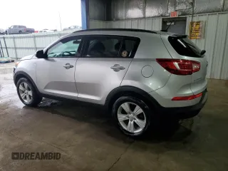 2013 Kia Sportage LX with VIN KNDPBCA22D7523558, listed as a Copart auction lot 49878375 with 72,024 mi miles and Salvage Title. Bid and sale history available at carsss.com. Image 2.