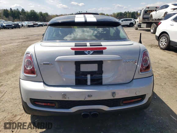 2012 MINI Coupe S z VIN WMWSX3C59CT465700, wystawiony jako Copart lot #52966245 z przebiegiem 136 253 mil mil oraz Szkody całkowita. Historia ofert i sprzedaży dostępna na DreamBid. Obrazek 6.