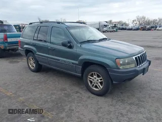 2003 Jeep Grand Cherokee Laredo with VIN 1J4GX48S03C536709, listed as a IAAI auction lot 41908946 with 240,435 mi miles. Bid and sale history available at carsss.com. Image 1.