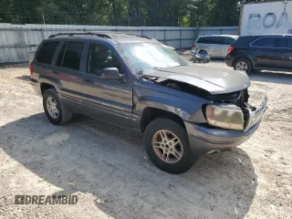 2002 Jeep Grand Cherokee with VIN 1J8GX48S12C255290, listed as a Copart auction lot 57832025 with 191,293 mi miles and Non repairable. Bid and sale history available at DreamBid. Image 4.