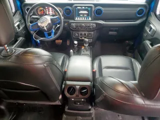 2023 Jeep Wrangler Sahara with VIN 1C4HJXEG7PW590252, listed as a Copart auction lot 59377765 with 32,689 mi miles and Salvage title. Bid and sale history available at DreamBid. Image 8.
