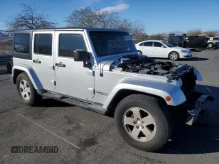 2007 Jeep Wrangler Unlimited Sahara with VIN 1J4GB59197L144781, listed as a Copart auction lot 48678315 with 137,538 mi miles and Salvage title. Bid and sale history available at DreamBid. Image 4.