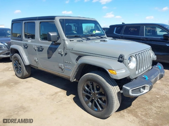 2023 Jeep Wrangler 4xe Sahara with VIN 1C4JJXP62PW696002, listed as a IAAI auction lot 41891127 with 44,567 mi miles. Bid and sale history available at carsss.com. Image 1.