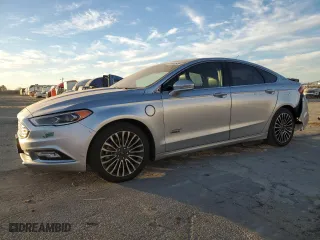 2017 Ford Fusion Energi Titanium with VIN 3FA6P0SUXHR379807, listed as a Copart auction lot 84885494 with 100,735 mi miles and Salvage Title. Bid and sale history available at carsss.com. Image 1.