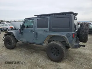2015 Jeep Wrangler Unlimited Rubicon with VIN 1C4BJWFG7FL674201, listed as a Copart auction lot 49466455 with 0 mi miles and Salvage Title. Bid and sale history available at carsss.com. Image 2.