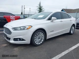 2013 Ford Fusion SE Hybrid with VIN 3FA6P0LUXDR326162, listed as a IAAI auction lot 41538999 with 148,112 mi miles. Bid and sale history available at carsss.com. Image 2.