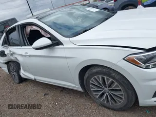 2021 Volkswagen Jetta S z VIN 3VWC57BU0MM085171, wystawiony jako IAAI lot #41688704 z przebiegiem 38 856 mil mil oraz . Historia ofert i sprzedaży dostępna na DreamBid. Obrazek 13.