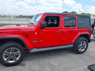 2019 Jeep Wrangler Unlimited Sahara with VIN 1C4HJXEG4KW573157, listed as a IAAI auction lot 42118373 with 105,890 mi miles and . Bid and sale history available at DreamBid. Image 14.