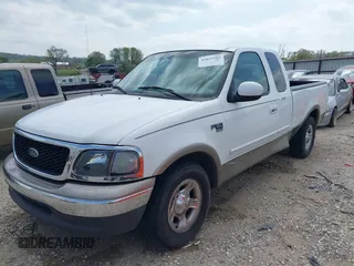 2003 Ford F-150 XL with VIN 1FTRX17L33NB79733, listed as a IAAI auction lot 42023385 with 136,236 mi miles. Bid and sale history available at carsss.com. Image 2.
