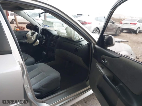 2003 Mazda Protege DX with VIN JM1BJ225030124381, listed as a IAAI auction lot 41607937 with 141,484 mi miles. Bid and sale history available at carsss.com. Image 5.