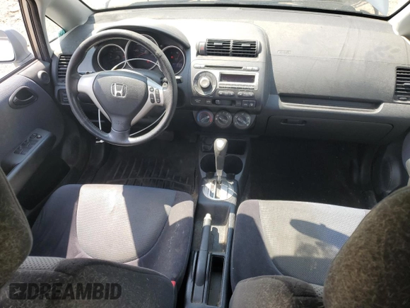 2007 Honda Fit Sport with VIN JHMGD38687S067648, listed as a Copart auction lot 64657345 with 123,055 mi miles and Salvage title. Bid and sale history available at DreamBid. Image 8.