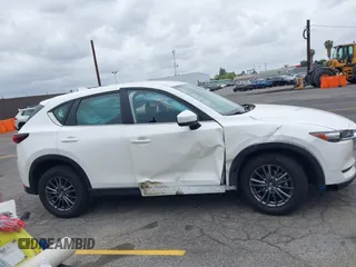 2019 Mazda CX-5 Sport with VIN JM3KFABM4K1565787, listed as a IAAI auction lot 42054585 with 80,580 mi miles and . Bid and sale history available at DreamBid. Image 13.