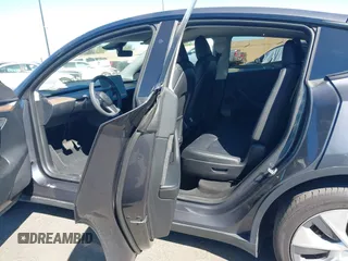 2023 Tesla Model Y Long Range with VIN 7SAYGAEE8PF976969, listed as a IAAI auction lot 41877784 with 25,896 mi miles. Bid and sale history available at carsss.com. Image 8.