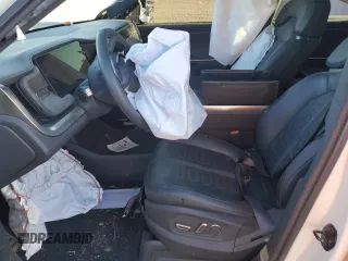 2023 Rivian R1S Launch Edition with VIN 7PDSGABL3PN003708, listed as a Copart auction lot 71564604 with Not Provided miles and Salvage Title. Bid and sale history available at carsss.com. Image 7.